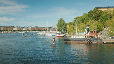 the embankment of stockholm beautiful yachts and old houses a clear sunny day in the capital of swed