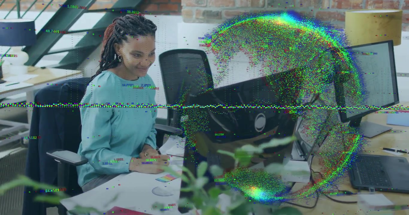 Designer woman picking pen sketching palettes for design work and glitch overlay pulsing on monitor