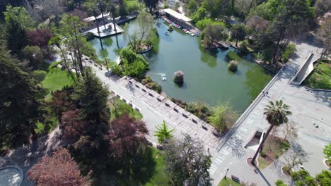 aerial view of the lagoon in quinta normal park, boating activities, sunny day in santiago, chile