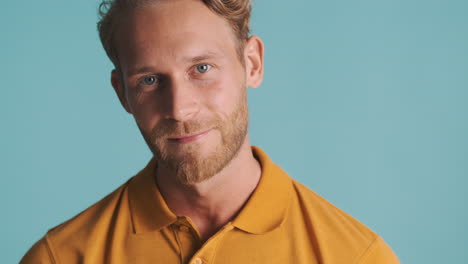 bearded man smiling and nodding his head