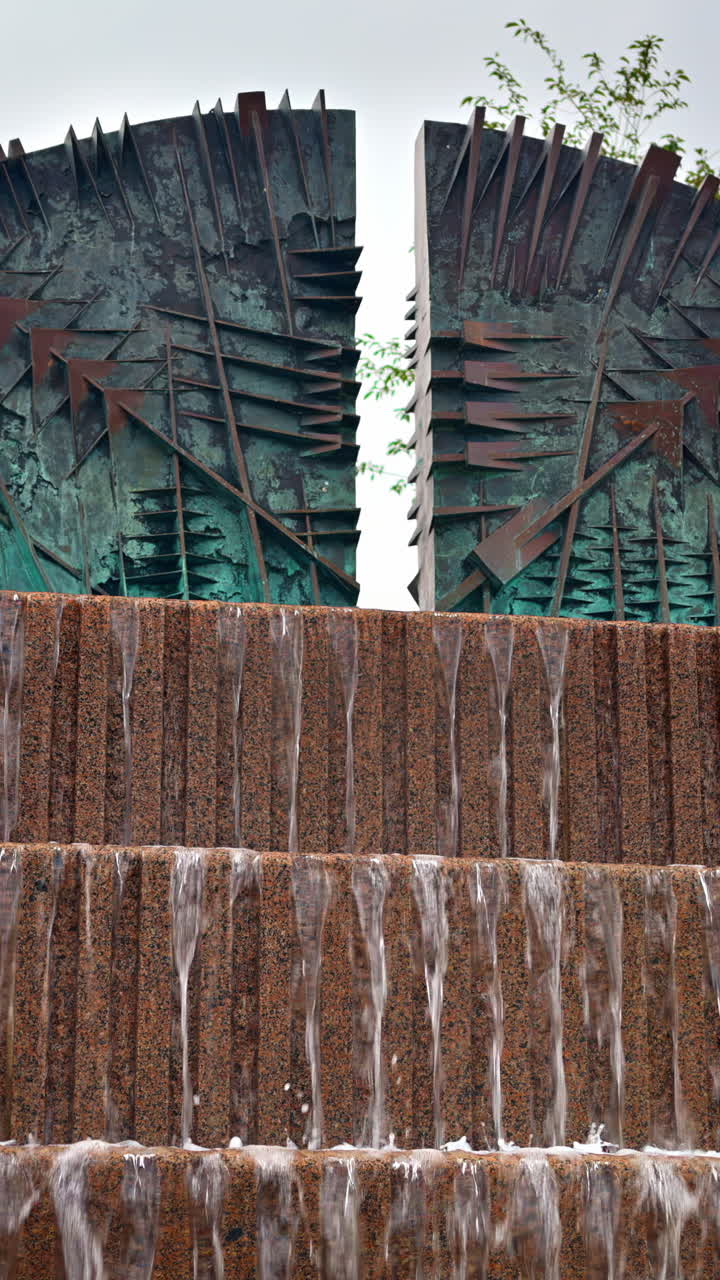 Artificial waterfall in Amaliehaven park, Copenhagen, Denmark. Vertical
