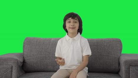 Happy-Indian-boy-talking-to-the-camera-Green-screen