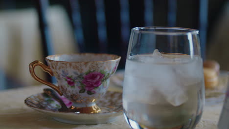 sugar cube falling into cup at an exquisite tea party