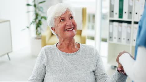 happy,-senior-woman-and-caregiver-holding-hands