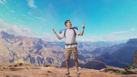 full body of asian male hiker with mountaineering backpack smiling and spreading arms enjoy looking the view around while traveling at the top of mountain