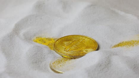 bitcoin coins in sand