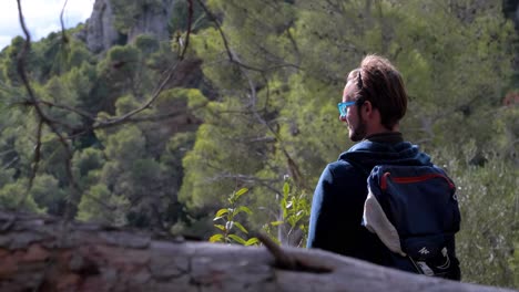 Slow-motion-shot-of-a-man-hiking-in-the-woods-near-the-Sète-salt-flats