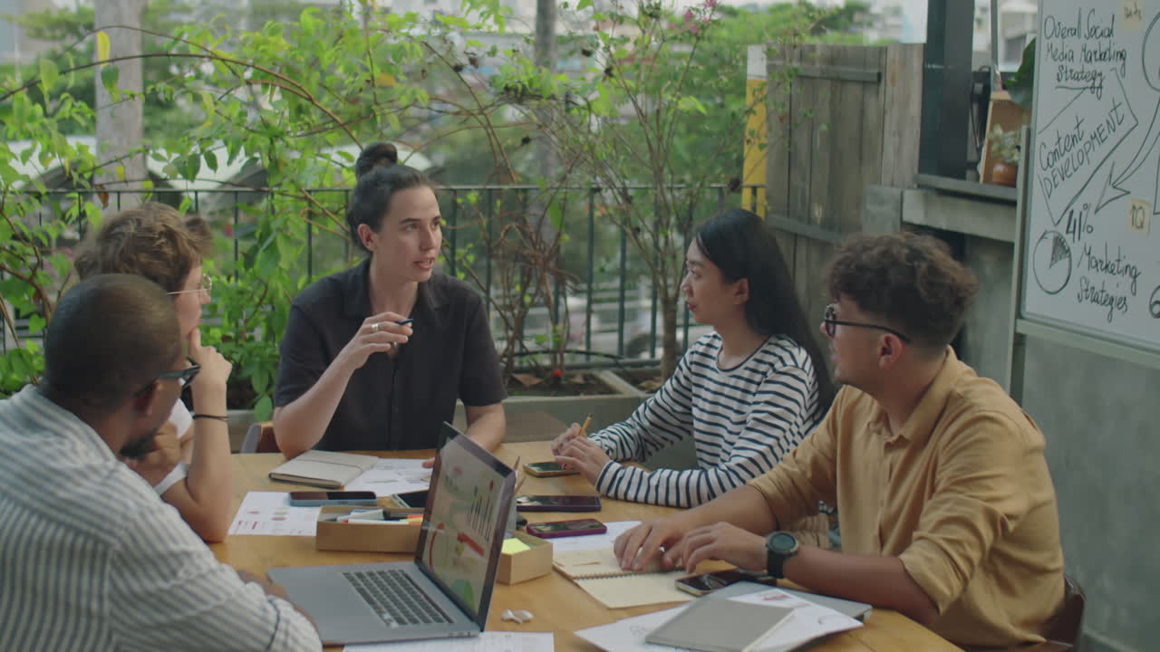 A diverse group collaborates at a business meeting