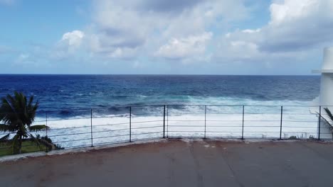 Flying-through-doorway-and-over-balcony-to-ocean-view-and-swimming-pool