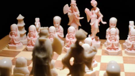 chessboard spinning, pieces formation, paws head to head in the center. black background