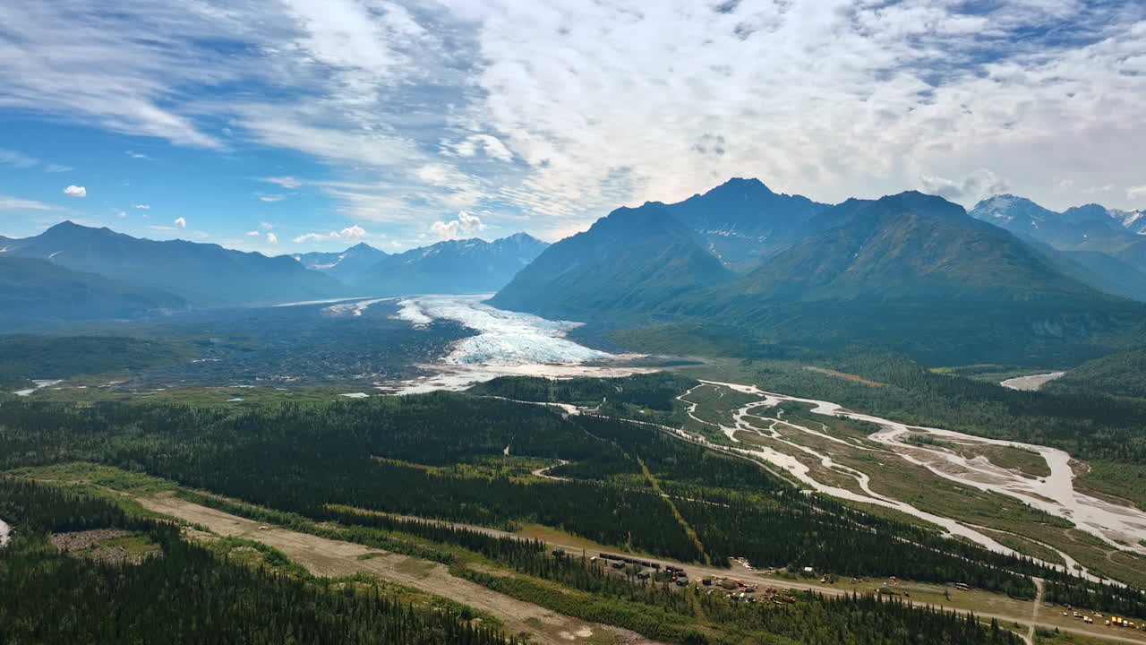 Glacier valley view in Alaska. Expansive view of Alaska’s glacier valley surrounded by rugged mountain peaks
