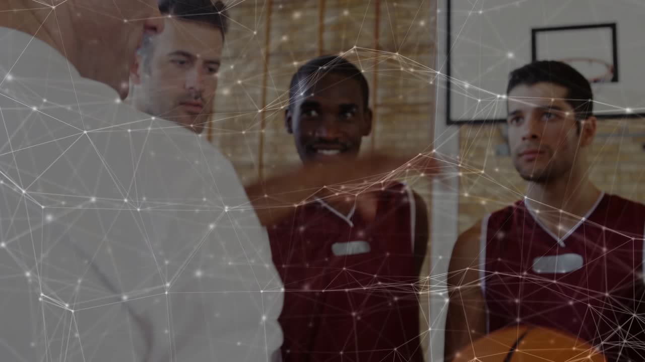 Team reaching gripping basketball for control as player lifting under hoop web linking wrists