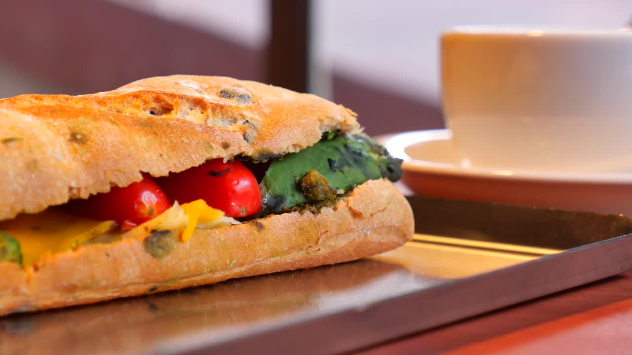 Sandwich with grilled vegetables and coffee