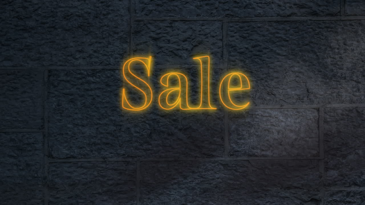 texto de venta de neón amarillo contra contra pared de ladrillo gris en el fondo