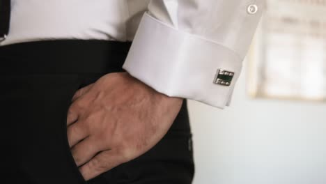 man in elegant suit close up hand in pocket, wedding and business concept