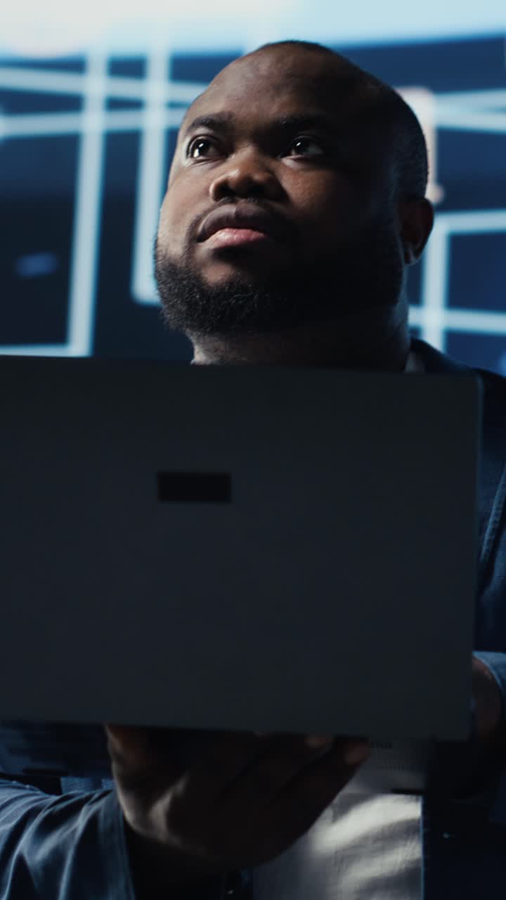 African American Man Opening Laptop and Looking at Screen