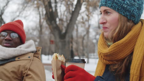 friends enjoying a winter lunch outdoors