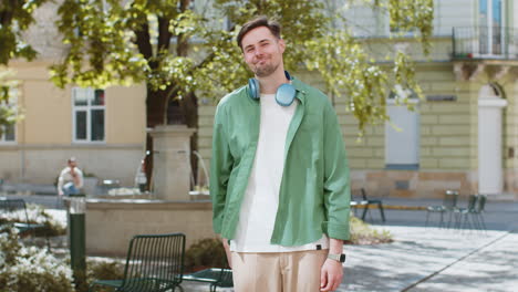 caucasian man looking approvingly at camera showing ok gesture positive like sign okay celebrate win