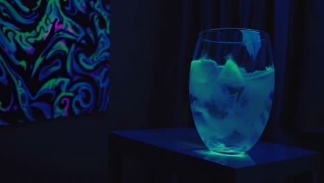 abstract neon art and a glass vase