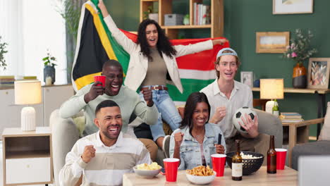 friends celebrating a soccer game with a south africa flag