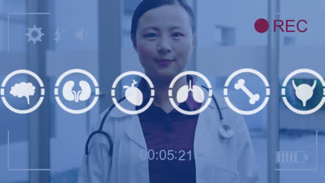 animation of medical icons data processing over asian female doctor