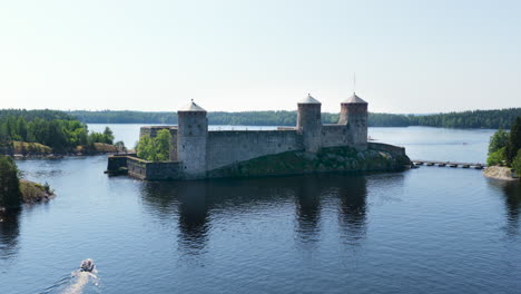 aerial view approaching the olavinlinna castle, sunny, summer day in finland