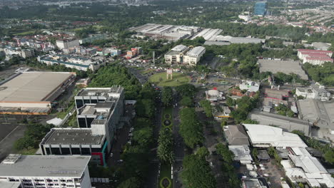 city streets with traffic intersecting at the roundabout in jakarta, indonesia on morning rush hour