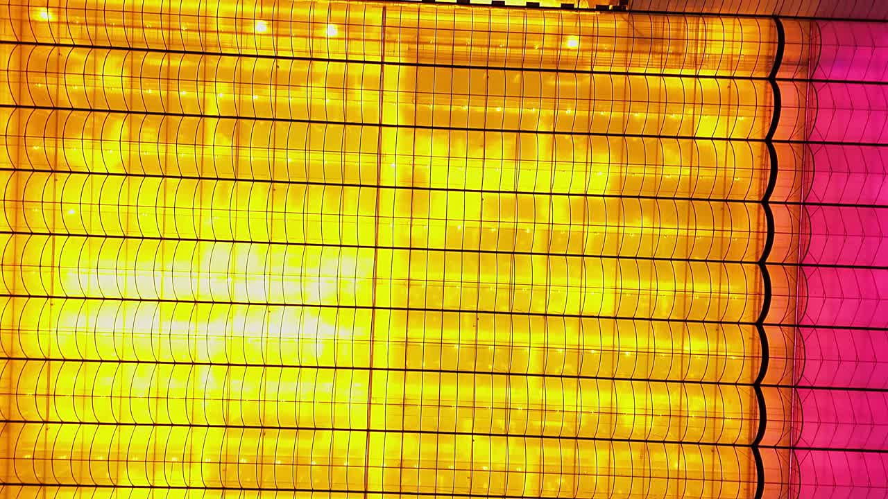 Topdown view of illuminated curved greenhouse structures in Carlton, Michigan, USA