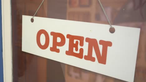 open sign on a store window