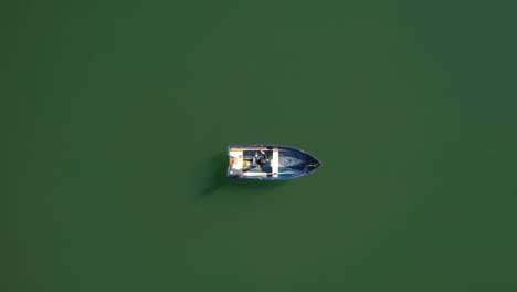 Woman-on-the-boat-catches-a-fish-on-spinning-in-Norway.