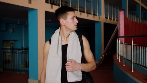 young man going out of the gym