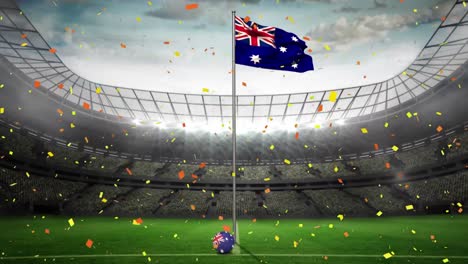 Confeti-Dorado-Cayendo-Ondeando-La-Bandera-De-Australia-Contra-El-Estadio-Deportivo-En-Segundo-Plano.