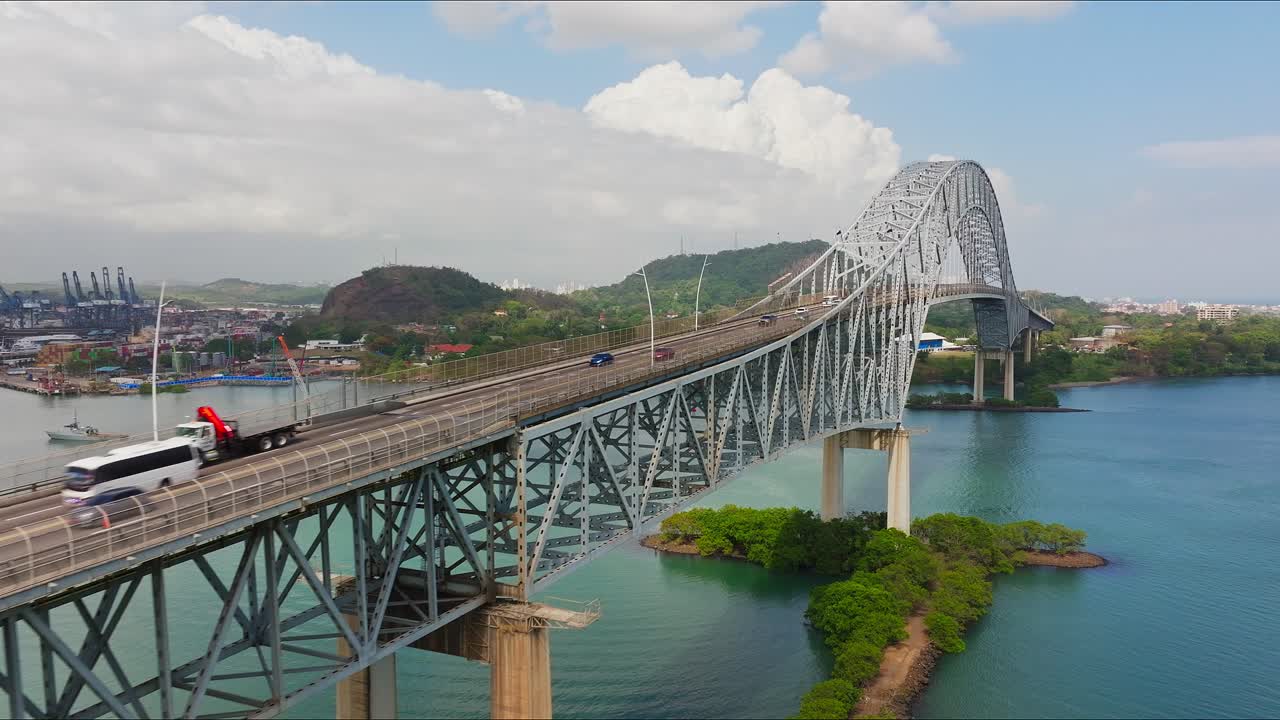 Aerial footage of Panama canal first bridge heading towards the city