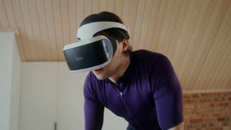 man wearing vr headset exercising at home