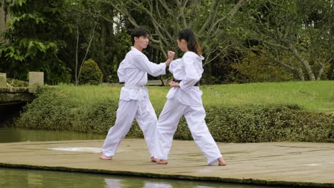 young couple fighting in class outdoors