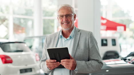 car salesman with tablet in dealership