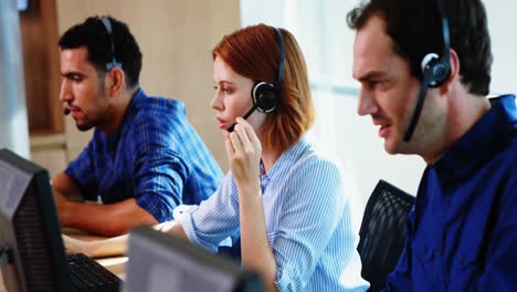 team of business executives working together at desk