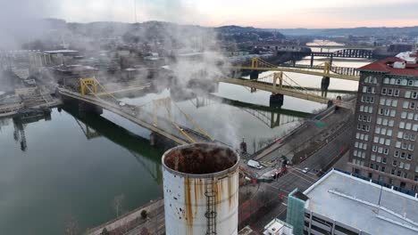 steam coming out of smokestack in downtown pittsburgh