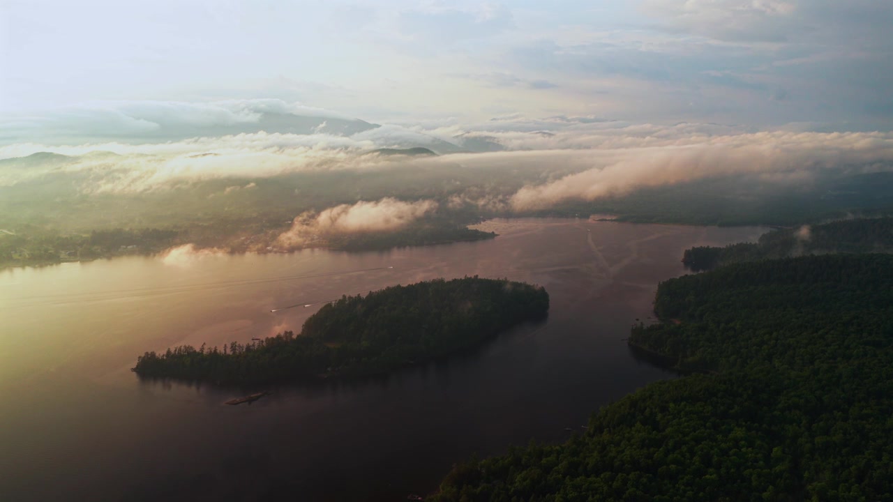 Lake Schroon Clarks Island WOL jet skis summer golden hour sunset mist low clouds aerial drone harbor view Up State New York landscape Town of Schroon Lake Pharaoh Mtn Adirondack Mountains backwards