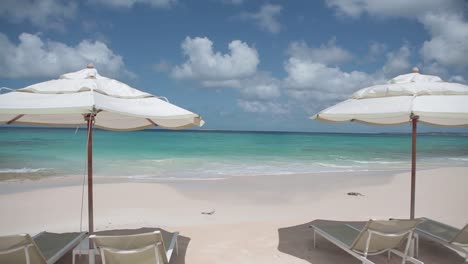 walking pov to anguilla caribbean sea white sand tropical paradise island with beach umbrella and chair