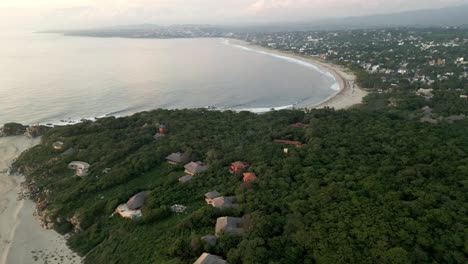 Drone-approaching-La-Punta-Zicatela-beach-in-Puerto-Escondido-Oaxaca-Mexico