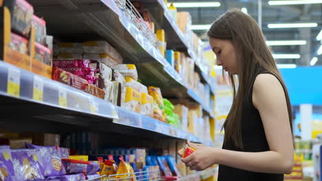 woman shopping for snacks in a supermarket