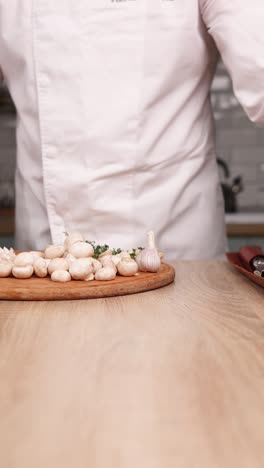 chef using marble mortar and pestle to prepare food