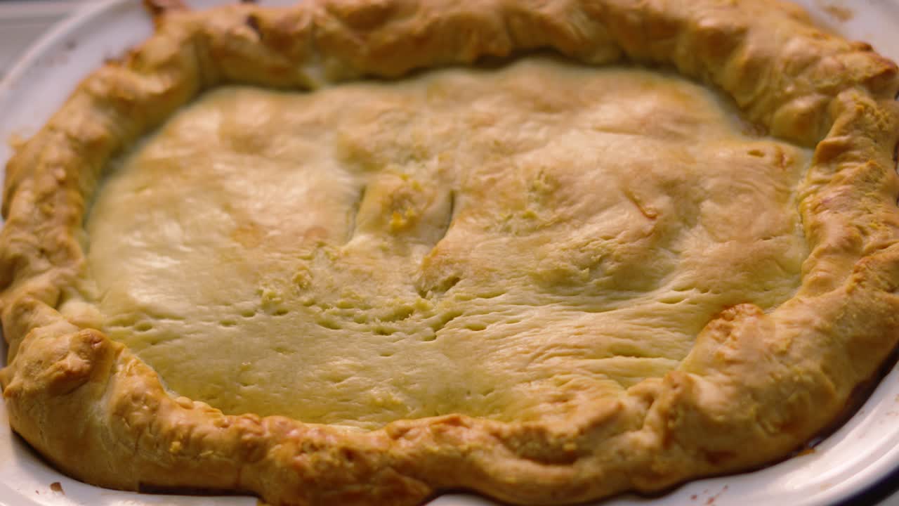 Homemade Deep Filled Shortcrust Chicken Mushroom Vegetable Pie Cooling After Cooking in High Temperature Oven with Golden Pastry Ready to Serve. Comforting British Tasty Delicious Food.