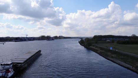 container vessel of crigee sails through oude maas river in puttershoek in south holland