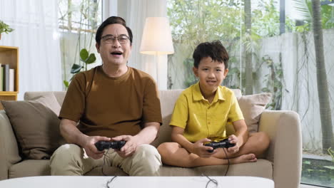 asian man and boy in the living room