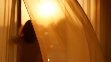 golden sunlight streaming through a sheer curtain