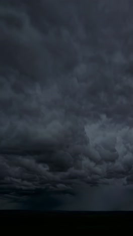 Dramatic low-angle video capturing a stormy sky with dark, swirling clouds and vivid lightning