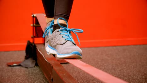 woman doing balancing exercise in fitness studio 4k