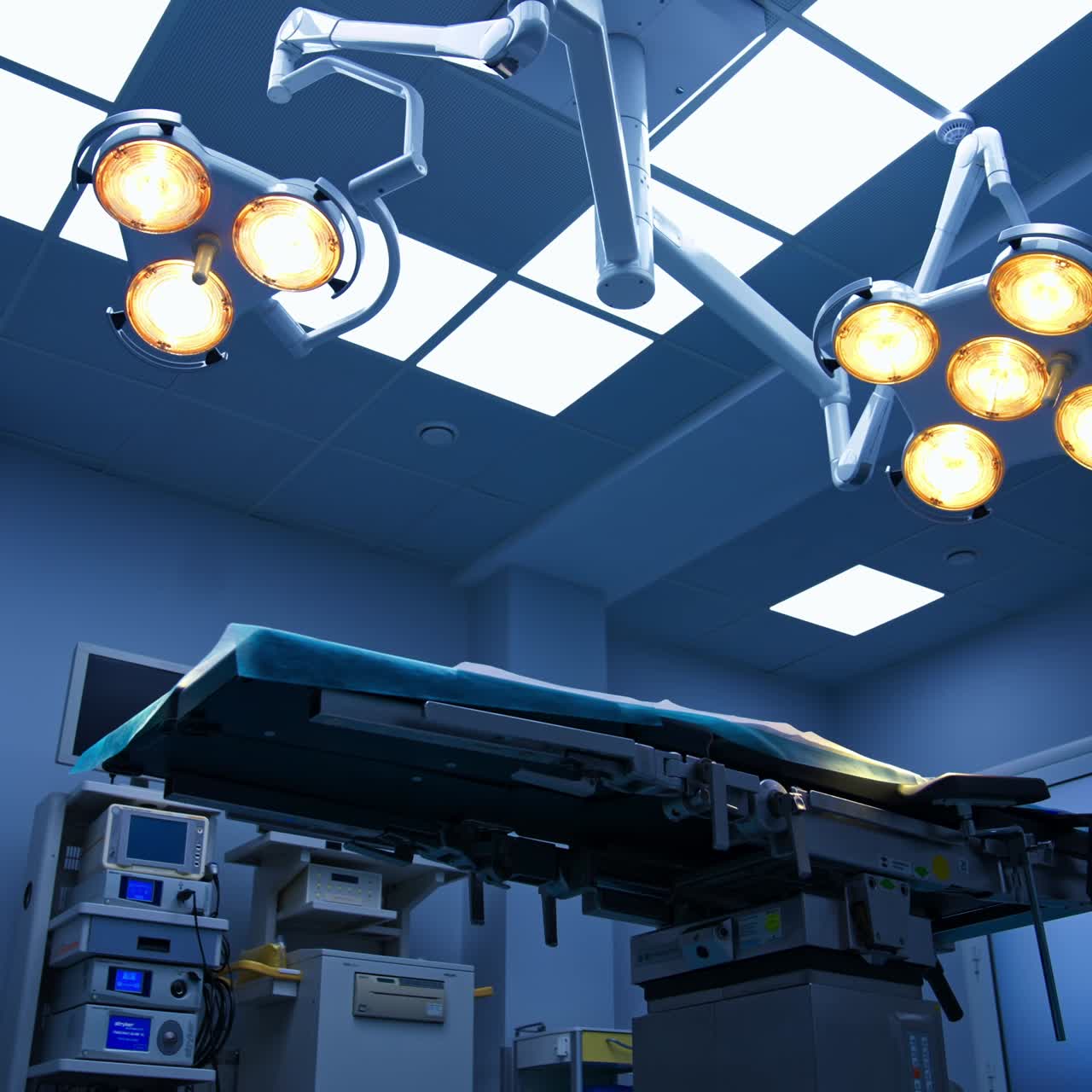 Lights on in the modern operational room. Big white surgical theatre ward with advanced equipment from low angle view